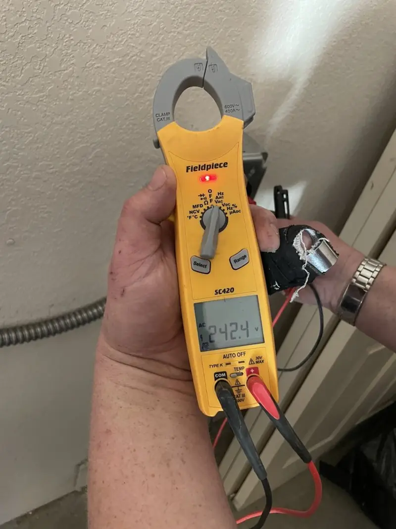 Voltage testing with clamp meter during Electrical Installation Services in Somersworth